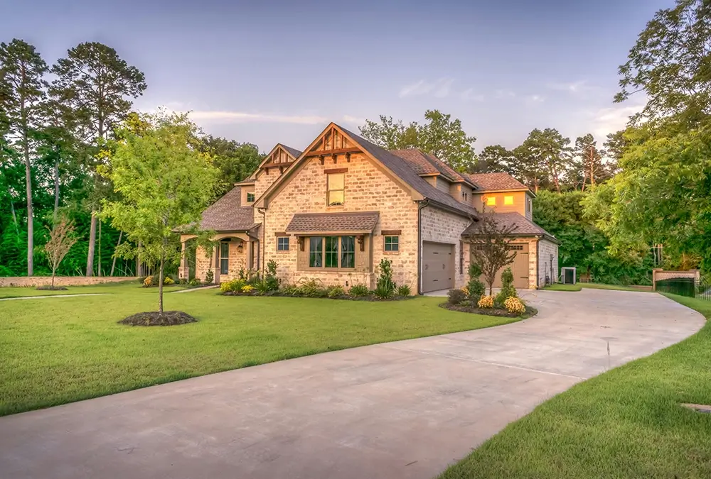 A large house with a driveway in front of it.