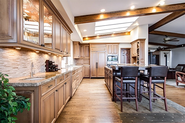 A kitchen with wooden cabinets and floors